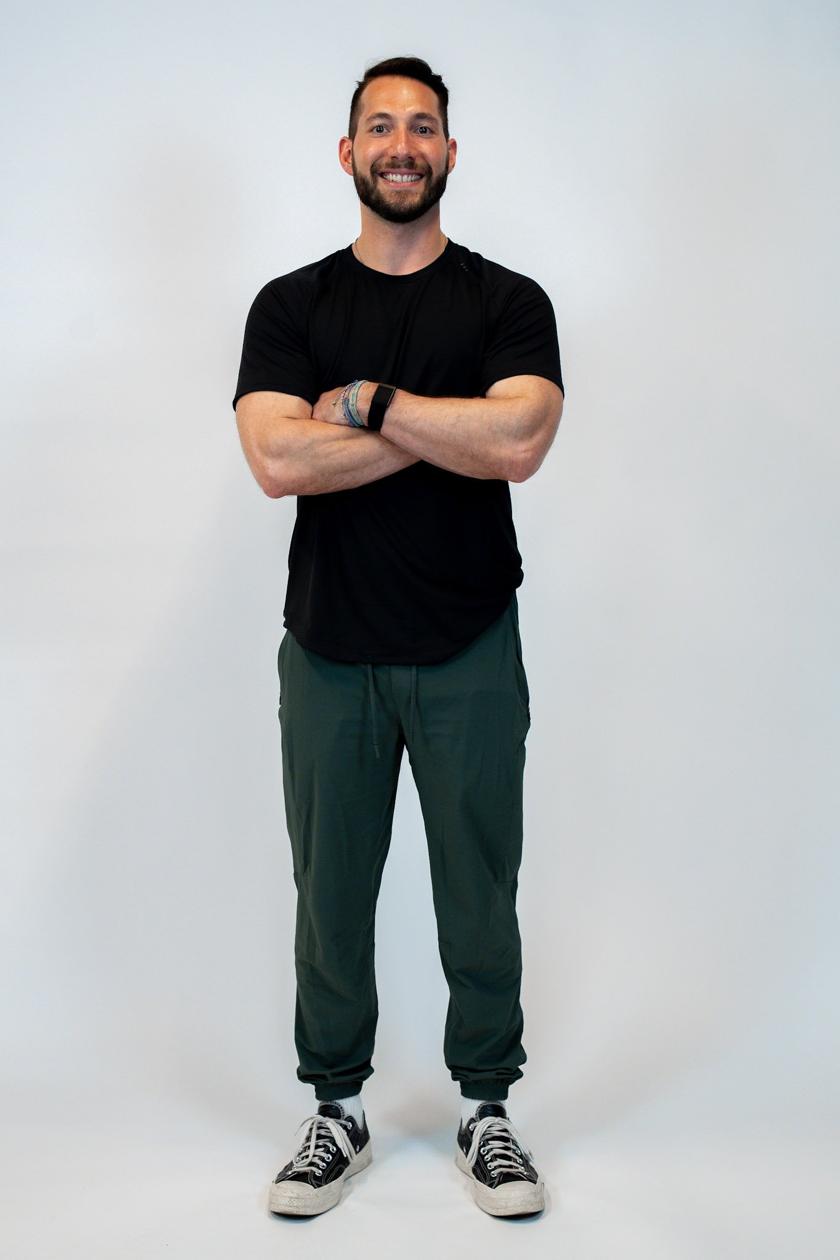 Nate, founder of Ka Blau Fit, standing with arms crossed and smiling