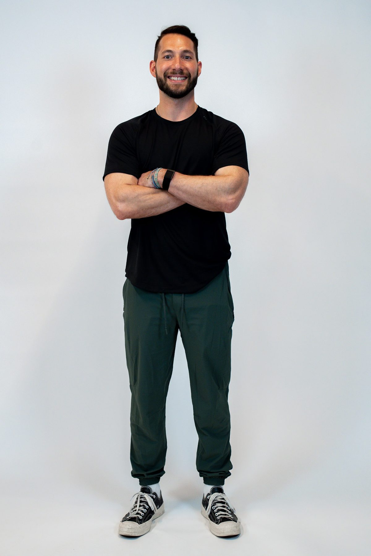 Nate, founder of Ka Blau Fit, smiling with arms crossed